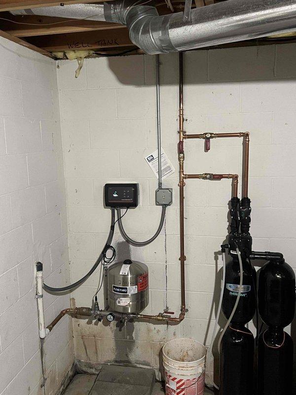 Returned to property to follow up on constant pressure system installation previously sold. Inspected existing basement utility area with well tank, pressure control system, and water treatment equipment. Identified necessary components and confirmed replacement parts have been ordered with expected arrival Monday. Full installation scheduled as an all-day service once parts are received.