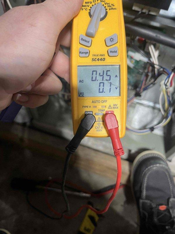 Performed heating maintenance on air handler for club member. Conducted electrical diagnostic testing using Fieldpiece SC440 multimeter, measuring voltage (0.1V) and amperage (0.45A) to verify proper electrical operation of the system. All readings within normal parameters.