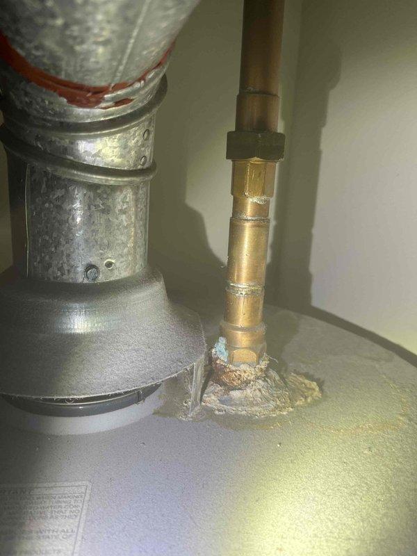 Responded to service call for clogged kitchen sink and dishwasher. Upon inspection, discovered significant buildup of sediment and debris causing drainage obstruction. Successfully cleared the blockage and verified proper drainage function for both fixtures. Also noted corrosion and mineral deposits on water heater piping connections that may require future attention.