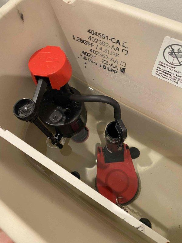 Performed complete replacement of kitchen garbage disposal unit, installing new "Pager 1" model with proper electrical and plumbing connections. Additionally, replaced toilet tank internal components including flush valve assembly and fill valve mechanism with new parts featuring red caps. Both installations were completed with verification of proper function and no leaks.