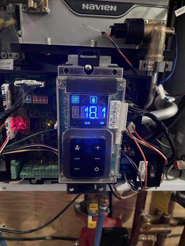 Responded to a callback for a water pressure sensor issue on a Navien unit. Located and replaced the faulty pressure sensor as previously diagnosed and sold by Chris. Verified proper system operation with the new sensor installed, confirming normal water pressure readings of 8.1 psi and temperature regulation at 109°C. System now functioning correctly.
