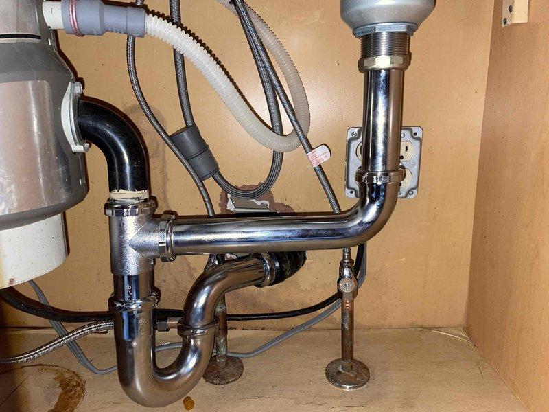 Diagnosed and repaired leaking kitchen sink faucet. Inspection of the plumbing system revealed minor water staining on the cabinet floor, indicating previous leakage. Completed necessary repairs to eliminate the leak and ensure proper function of the faucet assembly.
