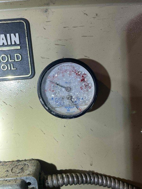 Responded to service call for 30-40 year old oil boiler that was repeatedly tripping reset button and exhibiting water feed line leak. Inspection revealed significant moisture buildup in pressure gauge and corrosion on internal components. Replaced damaged mounting bracket and addressed leaking water feed line to restore proper system operation.