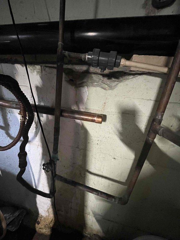 Responded to service call for 30-year-old water heater with pilot light failure. Upon inspection of the aging unit with copper supply lines and metal ventilation duct, determined the thermocouple had failed, preventing pilot light ignition. Replaced thermocouple, tested system operation, and confirmed proper hot water production.