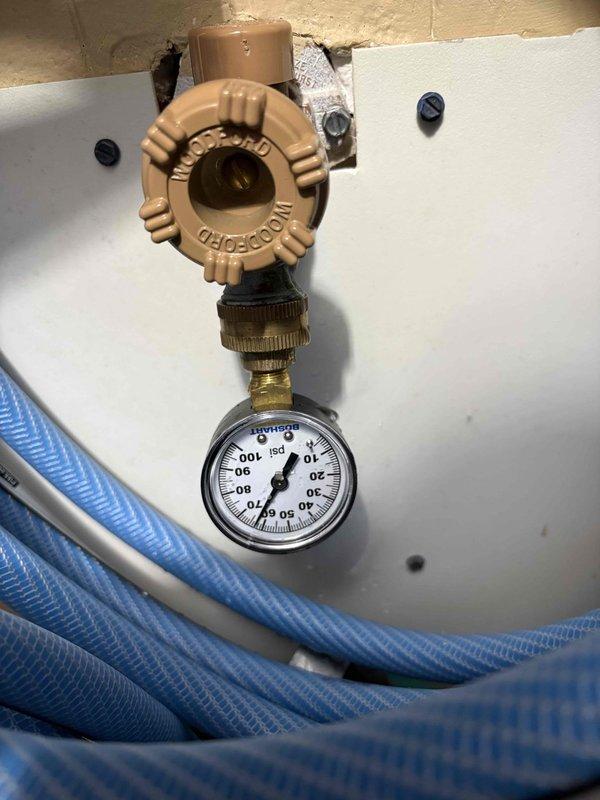 Successfully installed new tanked water heater as per previous sale agreement. Verified proper pressure readings of approximately 50-60 PSI on the Woodford valve assembly. Installed expansion tank with appropriate copper and galvanized pipe connections, ensuring all fittings were secure and operational with no leaks detected.