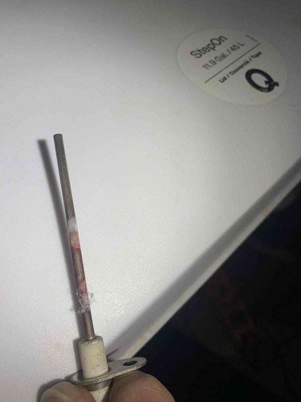 Responded to no-heat call where furnace was inoperative and home temperature had dropped to 60 degrees. Diagnostic testing revealed a faulty flame sensor with visible corrosion. Cleaned and reinstalled flame sensor, restoring proper flame detection and returning system to normal operation.