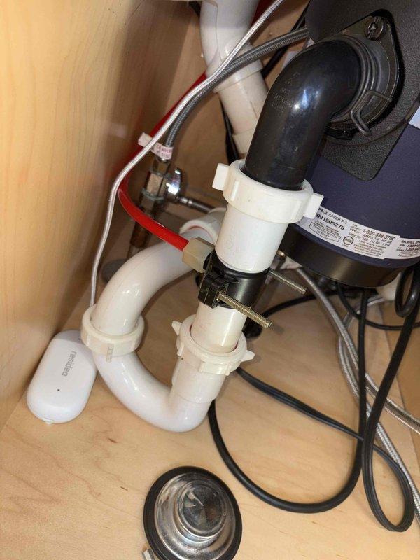 Responded to automatic water shutoff activation due to leak detection. Located leak source in HVAC room and inspected plumbing components including P-trap drainage system, supply lines, and water heater connections. Repaired leak, reset automatic shutoff system, and restored water service to the property.