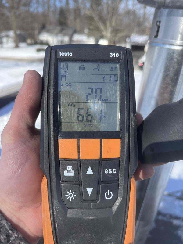 Installed garage heater as follow-up to previous sale. Identified and corrected improper Kdzgas line installation. Combustion analysis performed with Testo 310 showing acceptable parameters - final readings of CO at 11ppm, CO₂ at 6.6%, and O₂ at 4.3%. Coordinated with roofer for proper venting completion.