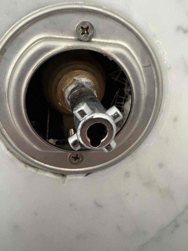 Successfully replaced customer supplied pressure control stem for rain shower, resolving issues with the existing valve which showed signs of mineral deposits and corrosion. Completed installation of the new component with proper connection to the existing plumbing system, ensuring optimal water pressure control functionality.