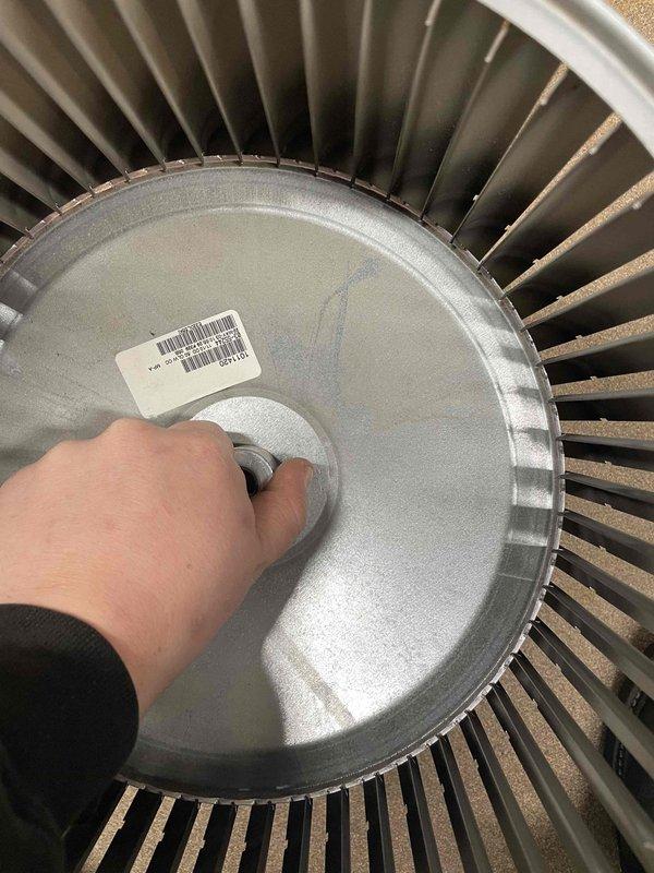 Returned to complete previously sold repair by replacing blower wheel in customer's furnace. Accessed interior components by removing front panel, installed new blower wheel assembly within the air handler section, and verified proper operation of the system after installation.