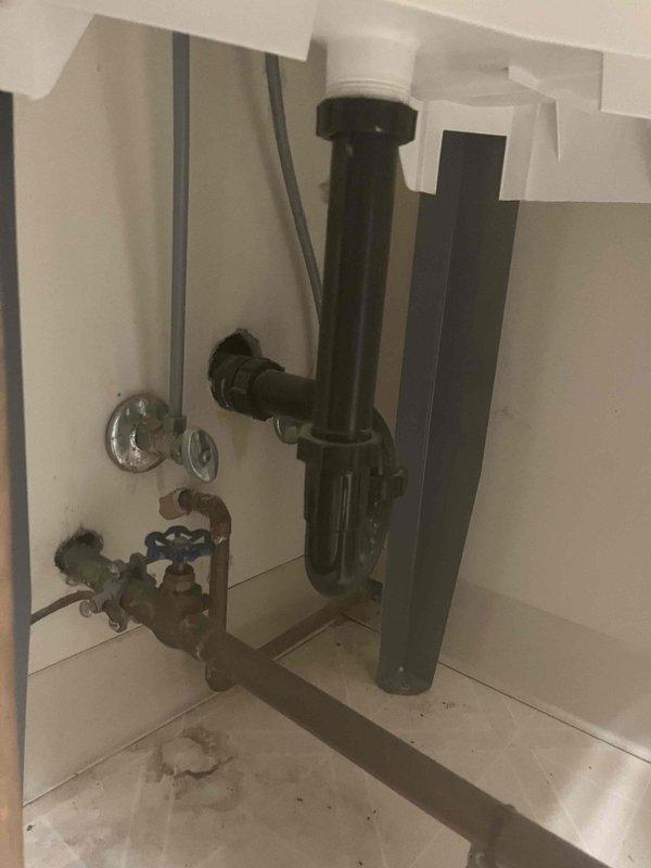Responded to service call for running toilet. Discovered significant water damage to wooden flooring beneath the toilet, indicating prolonged leakage. Performed repair of toilet flush mechanism and inspected adjacent plumbing fixtures for proper functionality to prevent further water damage.