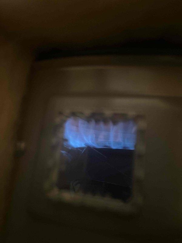 Responded to service call for water heater with pilot light issues. Upon inspection, found pilot light extinguished. Successfully relit pilot and verified proper flame characteristics (strong blue flame) through viewing window. Confirmed water heater operation is now stable and functioning correctly.