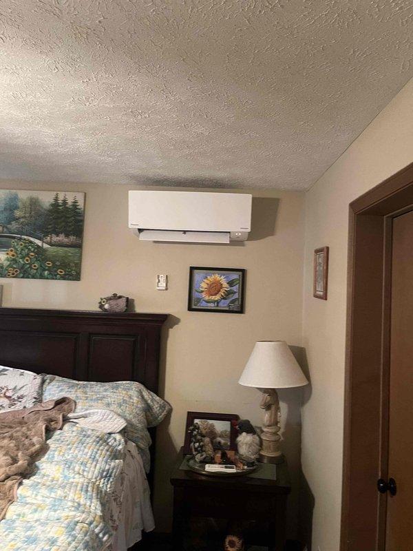 Performed heating maintenance on Daikin mini-split system per member's concern about improper operation. Verified system settings using remote control (displaying 71°F) and confirmed proper functionality of wall-mounted indoor unit. Completed scheduled plumbing maintenance during same visit as requested.