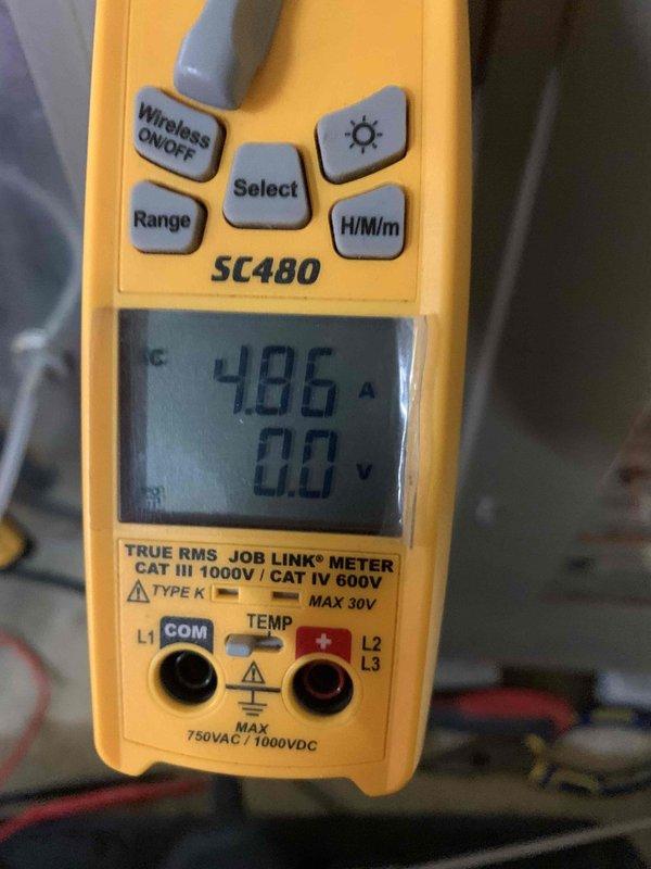Performed 2-year heating maintenance service on air handler system in basement mechanical room. Conducted electrical testing with SC480 True RMS meter, verifying amperage readings of 48.6A. Discussed potential humidifier installation and minor ductwork modifications with homeowners for future consideration.