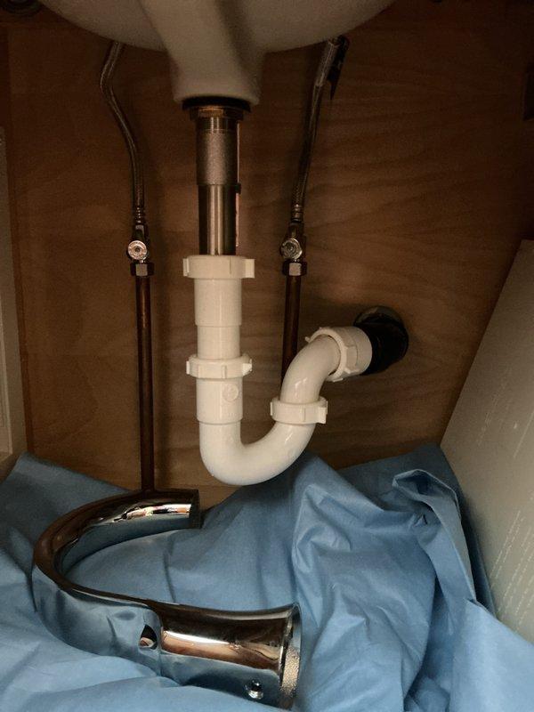 Performed Club inspection and diagnosed short cycling well issue. Installed warranty tub faucet parts from Moen (currently awaiting additional parts with approximately 2-week lead time). Inspected under-sink plumbing assembly, confirming proper installation of P-trap and supply lines with no visible leaks or damage.