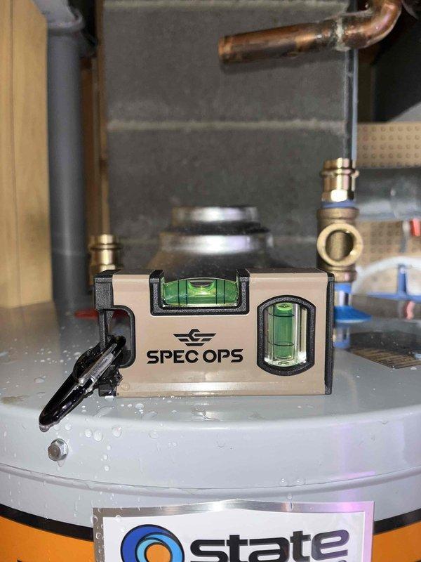 Completed installation of a 40-gallon standard vent water heater to replace existing unit. Noted the system connects to a shared WYE with previously installed furnace venting. Verified proper venting clearance and confirmed level installation of the new equipment with expansion tank properly mounted.