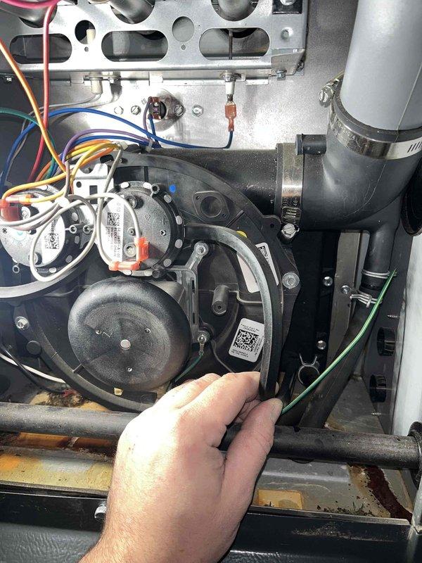 Completed scheduled maintenance service under HVAC plan and replaced failed inducer motor as previously sold. Performed electrical testing with multimeter to verify proper voltage and current draw on the new motor, confirming successful installation with readings within manufacturer specifications.