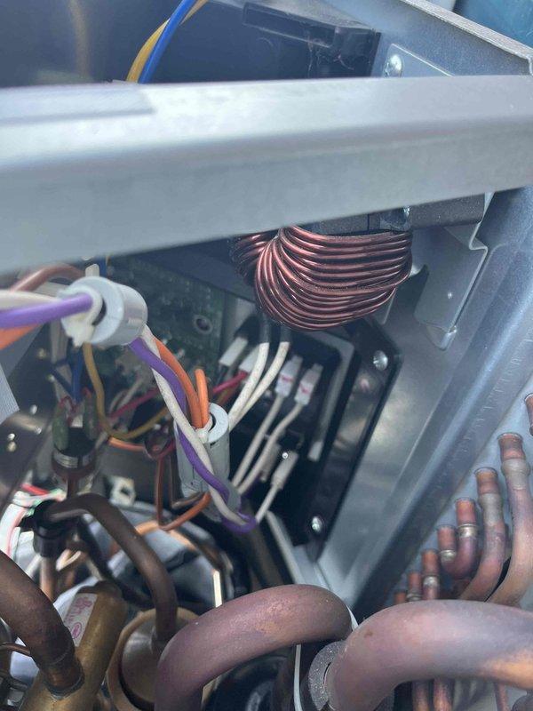 Responded to service call for mini split system in garage displaying error codes (9 blinks on operation, 5 blinks on timer). Inspected internal components including circuit board connections and copper coil assembly. Identified and repaired loose wire connections at the PCB terminal, restoring proper system functionality.