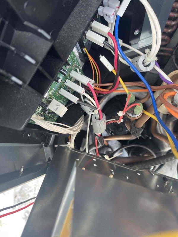 Responded to service call for mini split system in garage displaying error codes (9 blinks on operation, 5 blinks on timer). Inspected internal components including circuit board connections and copper coil assembly. Identified and repaired loose wire connections at the PCB terminal, restoring proper system functionality.