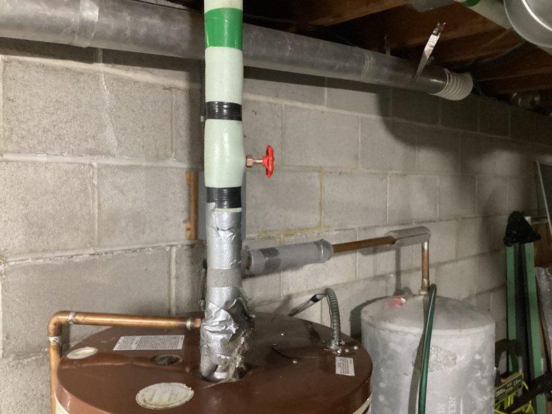 Conducted site assessment for potential installation of Aprilaire humidifier system. Inspected existing HVAC infrastructure including blue furnace unit with attached galvanized ductwork and water heater with PVC pipe connections. Documented current setup with photos to develop appropriate humidification solution for the residence.