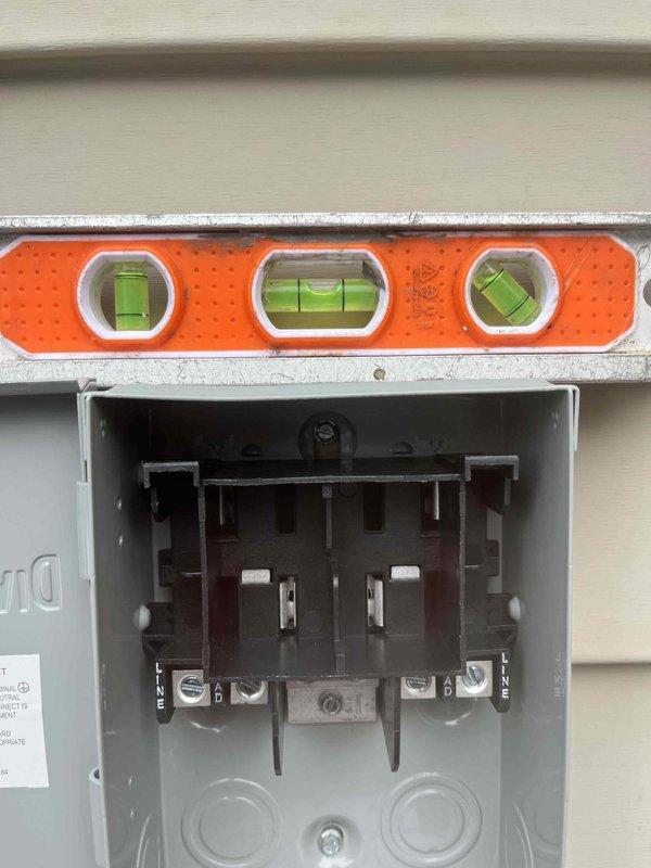 Returned to complete mini-split installation. Verified electrical connections at the meter base including proper circuit breaker installation with line and load terminals. Installed and tested 15A 250V AC fuses in the disconnect. Ensured all components were properly leveled and securely mounted per manufacturer specifications.