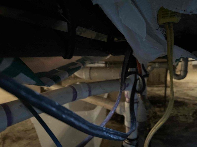 Responded to service call for backup in tub and sink. Upon inspection, accessed crawlspace to examine drainage system and identified blockage in main waste line beyond the house. Successfully cleared obstruction using drain cleaning equipment, restoring proper drainage function to all affected fixtures.