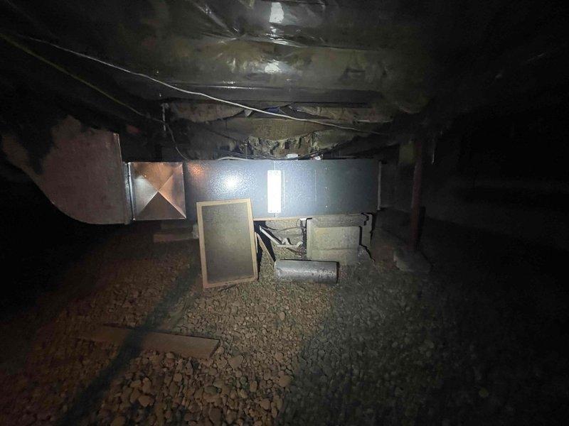 Responded to recurring humidifier leak issue in crawl space. Identified significant water damage on concrete block walls with visible moisture staining, efflorescence, and potential mold formation. Documented conditions with photos and addressed the leak source in the HVAC system to prevent further water infiltration.