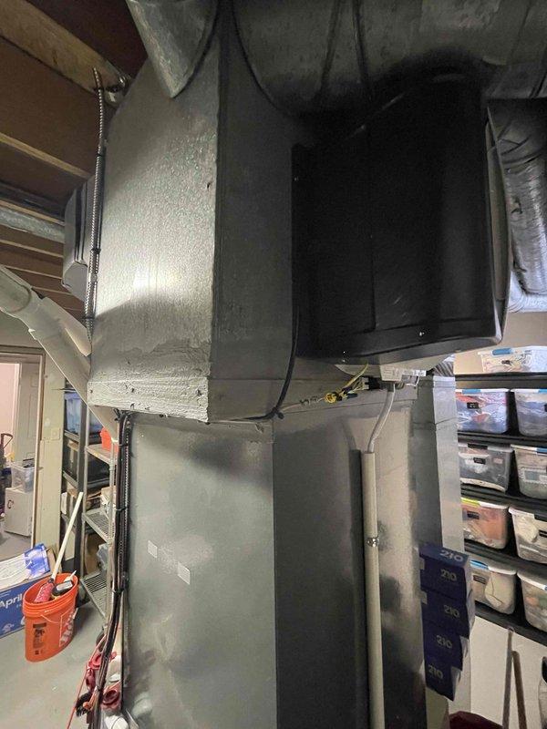 Completed installation of fan-powered humidifier system as previously sold. Installation included proper integration with existing HVAC ductwork and electrical connections in the utility area. Work was completed with all components properly sealed and secured.
