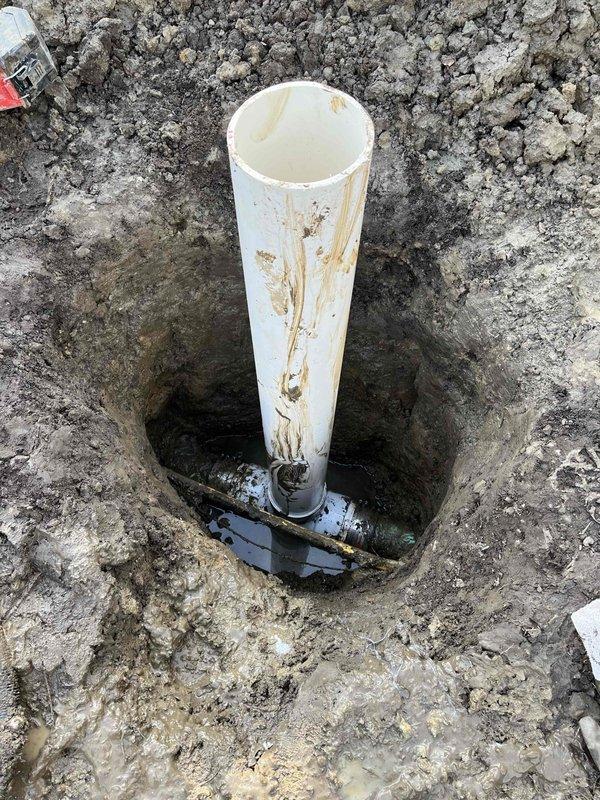 Successfully completed the spot repair by excavating the affected area and installing a clean-out access point. Connected a new PVC riser to the existing drain line, allowing for proper maintenance access as sold.