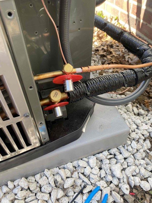 Completed installation of new complete HVAC system (APP ID 2603702625) with proper electrical connections and refrigerant line setup. System was properly leveled, disconnect switch installed and verified in OFF position, and service valves confirmed operational with appropriate insulation on refrigerant lines.