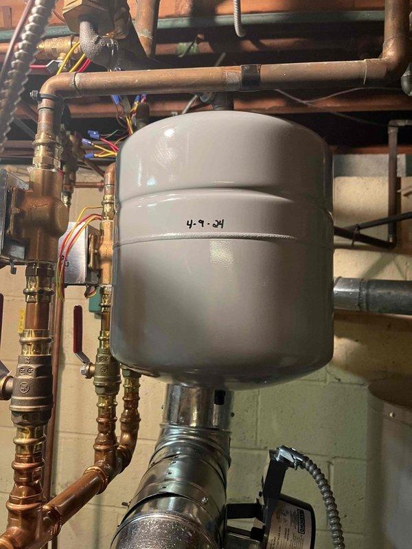 Performed heating maintenance on air handler as part of membership service. Conducted electrical testing with Fieldpiece SC480 multimeter to verify proper voltage and operation. Inspected expansion tank installed 4-9-04 and associated copper piping system, confirming all connections were secure with no signs of leaks.
