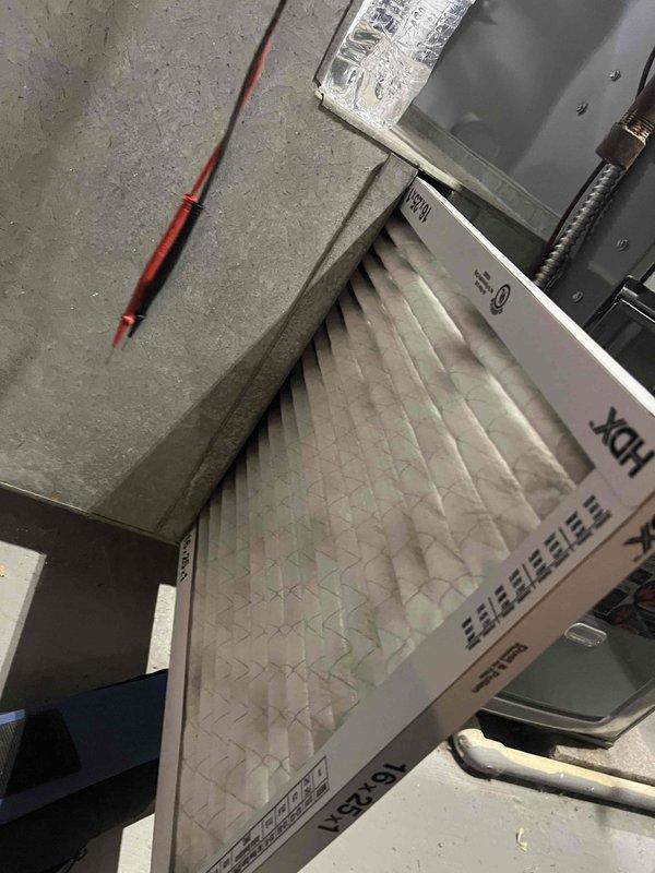 Performed standard furnace tune-up including inspection and cleaning of blower wheel assembly. Replaced air filter with new HDX filter to ensure proper airflow. Discussed options for addressing unheated room; recommended consultation with comfort specialist for potential system modification or zoning solution.