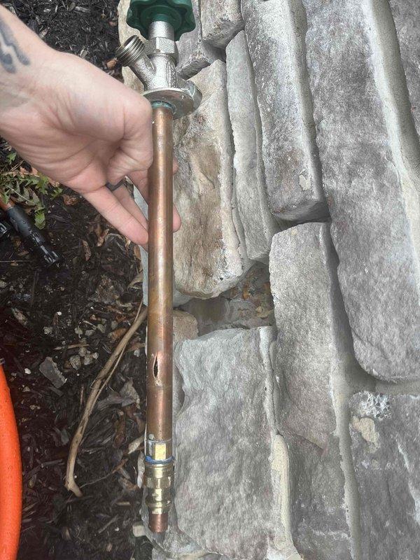 Responded to a recurring issue with a frost-free spigot that had catastrophically failed ("blew apart"). Upon inspection, observed copper supply piping with multiple valves and fittings in the utility area showing signs of previous water damage. Replaced the damaged exterior spigot assembly and verified proper operation to prevent further callbacks for this persistent problem.