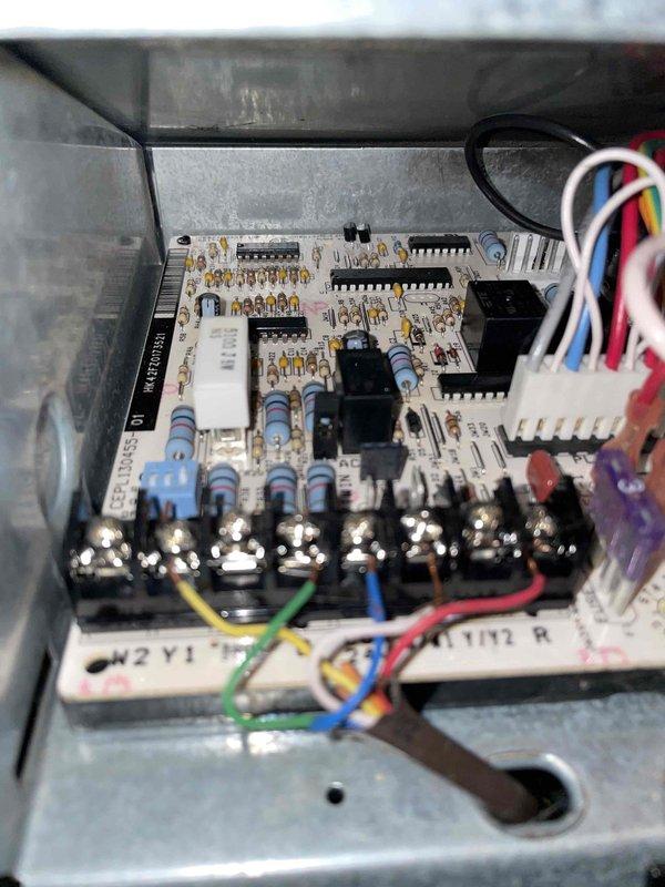 Performed scheduled heating maintenance on air handler unit per membership agreement. Inspected blower wheel assembly which showed moderate dust accumulation on blades. Examined control board components including capacitors, relays, and terminal connections; all electrical connections were secure with no visible damage to circuit board or wiring harnesses.