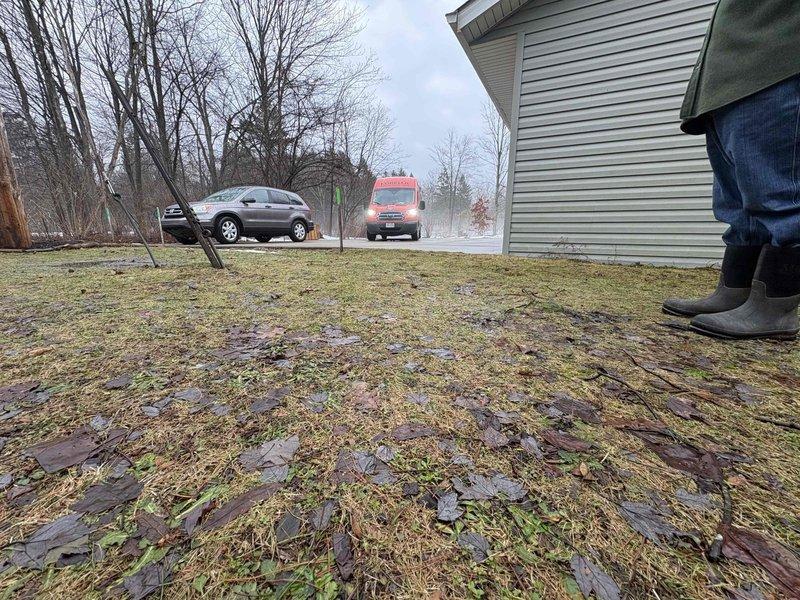 Responded to drainage issue where ground water was causing driveway heaving approximately 4 inches above garage floor level. Conducted assessment using level tool to confirm elevation discrepancy and identified inadequate drainage as root cause of water pooling beneath concrete. Implemented drainage solution to redirect ground water away from structure and prevent further driveway displacement.