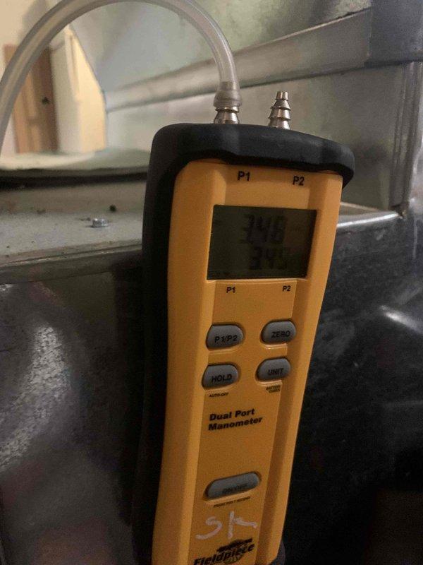 Completed diagnostic testing on furnace system using dual port manometer, revealing pressure readings of 345/111. Visual inspection with camera identified significant dust and debris accumulation in ductwork affecting airflow. Resolved thermostat calibration issue that was causing customer to set temperature abnormally high (76°) to achieve adequate heating.