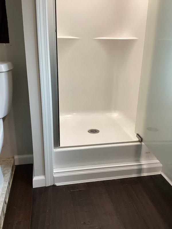 Responded to drainage issue where master bathroom toilet was backing up into shower and basement bathroom toilet was causing sewer odors. Inspected dual grinder pump system (one serving master bathroom, one serving basement) and performed main drain cleanout to restore proper flow and eliminate backup issues. Recommended regular maintenance to prevent future blockages and odor problems.
