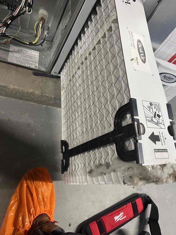 Performed standard heating maintenance on air handler unit for club member. Inspected and replaced air filter with new BestAir pleated filter. Removed and inspected igniter/flame sensor assembly, confirming proper operation before reinstallation.