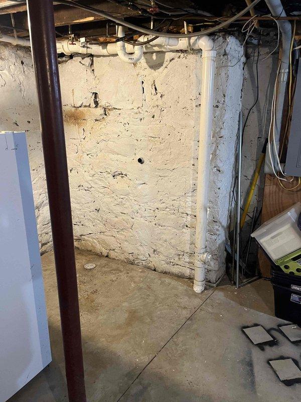 Inspected main sewer line with camera and confirmed root intrusion 10-35 feet from house access point. Documented existing basement plumbing configuration with visible PVC and copper piping infrastructure. Customer advised of needed line repair and has received previous estimate from another service provider.