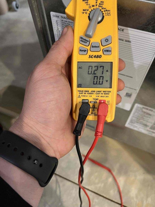 Performed scheduled heating maintenance on member's air handler system. Conducted electrical inspection revealing normal dust accumulation on connections. Measured system amperage (0.27A) and voltage (0.0V) with SC480 clamp meter to verify proper electrical operation of components.