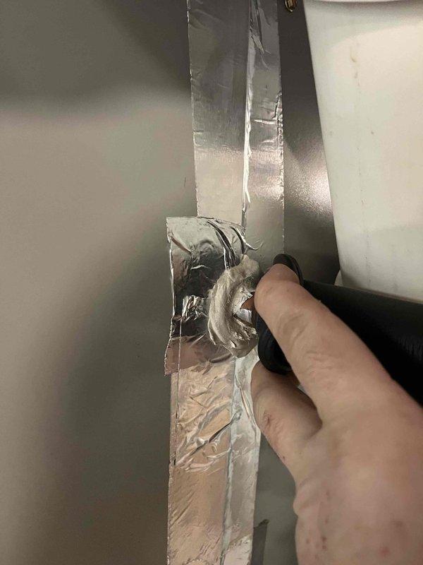 Responded to customer report of rattling noise in recently installed furnace system. Inspected unit and connections, noting system is heating properly. Applied foil tape to secure connection points and eliminate the source of the rattling noise.