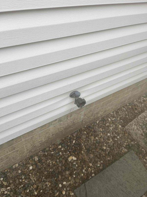 Inspected three faucets (two in garage, one on back patio) that were reported to leak when connected to hoses. Examined threads on all spigots and determined that worn threading was causing improper seal with hose connections. Repaired damaged threads and replaced washers on all three fixtures to restore proper functionality and eliminate leaking.