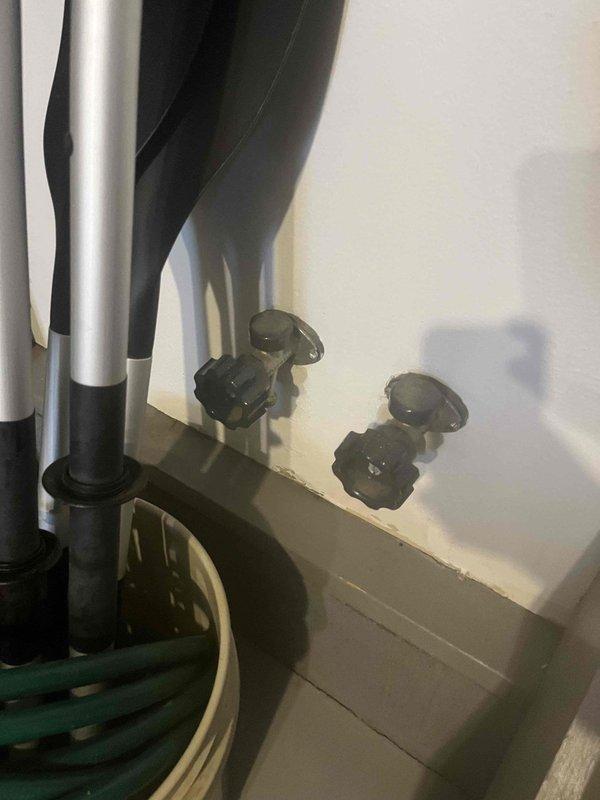 Inspected three faucets (two in garage, one on back patio) that were reported to leak when connected to hoses. Examined threads on all spigots and determined that worn threading was causing improper seal with hose connections. Repaired damaged threads and replaced washers on all three fixtures to restore proper functionality and eliminate leaking.