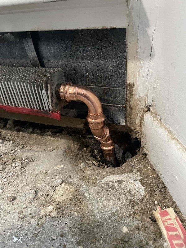 Responded to service call for a whistling boiler with low pressure gauge reading. Inspected the 25-year-old water heating system, including copper piping connections and pressure regulator valve assembly. Adjusted the Braukmann pressure reducing valve to correct the whistling issue and restore proper system pressure.