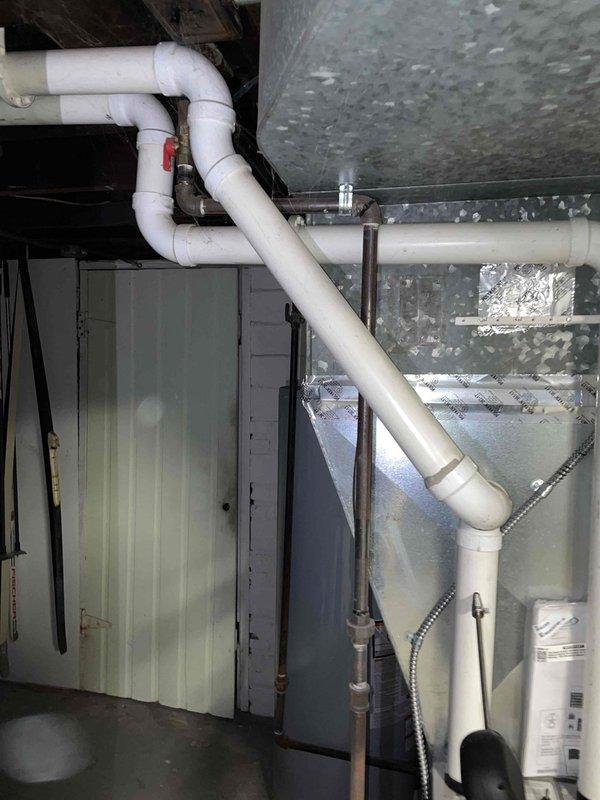 Responded to service call for non-functional furnace. Inspection of basement utility area revealed extensive cobweb buildup on plumbing infrastructure and signs of oxidation on metal fittings where copper/brass connects to PVC. System was thoroughly cleaned and restored to proper working condition.