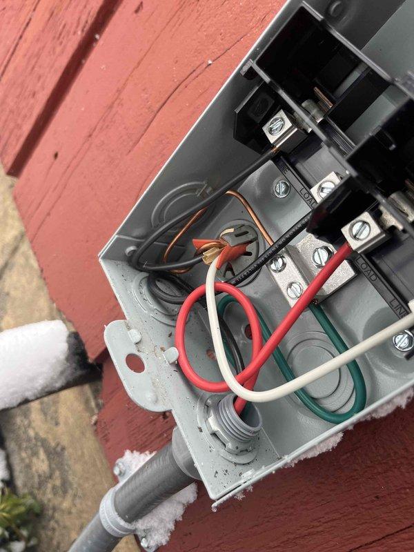 Performed warranty service call to inspect electrical disconnects mounted on exterior wall. Examined junction boxes showing deteriorated weatherproofing and potentially unsafe wiring connections. Replaced defective disconnects with new units, properly secured all electrical connections, and applied appropriate sealant to ensure weather-tight installation per manufacturer specifications.