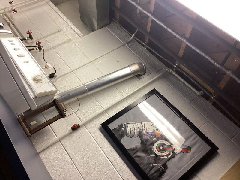 Assessed shallow P-trap on bathtub causing drainage issues and replaced with larger capacity trap to improve flow. Consulted with homeowner regarding gas line requirements for stove installation and evaluated existing exterior gas grill line for code compliance. Inspection of utility room revealed proper backflow prevention system with Apollo valve and appropriate PVC drainage configuration.