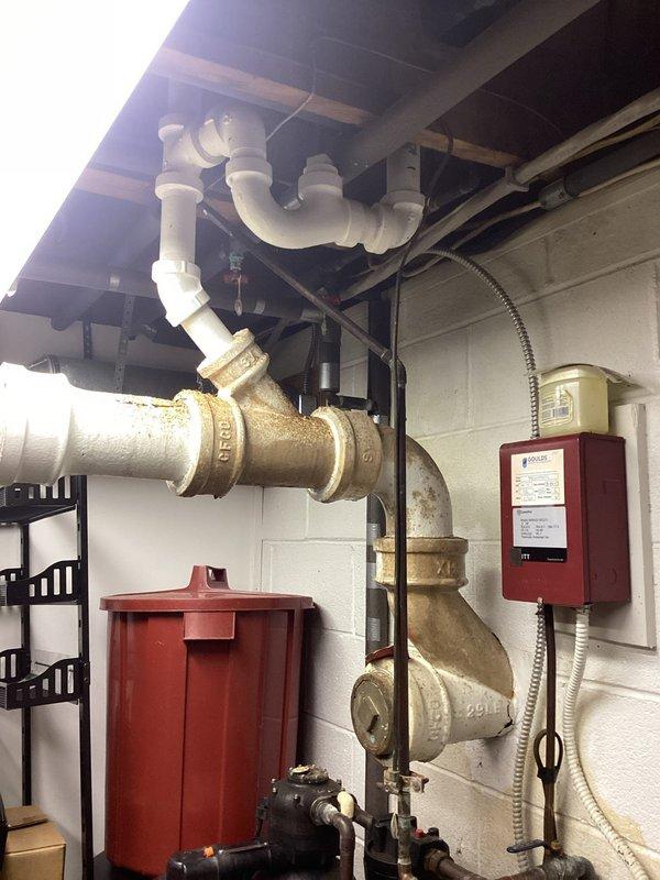 Assessed shallow P-trap on bathtub causing drainage issues and replaced with larger capacity trap to improve flow. Consulted with homeowner regarding gas line requirements for stove installation and evaluated existing exterior gas grill line for code compliance. Inspection of utility room revealed proper backflow prevention system with Apollo valve and appropriate PVC drainage configuration.
