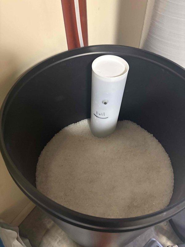 Responded to a callback regarding persistent odor and intermittent foaming in kitchen and bathroom water supply. Inspected water softener system, noting proper salt levels and function. Previous chlorination treatment of well had not resolved the issue. Documented water quality issues and recommended comprehensive water testing to identify potential contaminants causing the persistent odor and foam.