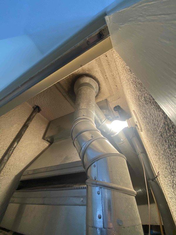 Completed warranty replacement of heat exchanger in American Standard furnace. Installed new ductwork with proper insulation and secured all connections. System is now operational with proper ventilation through the metal exhaust pipe system.